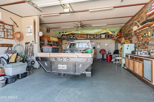 garage with a workshop area and a garage door opener