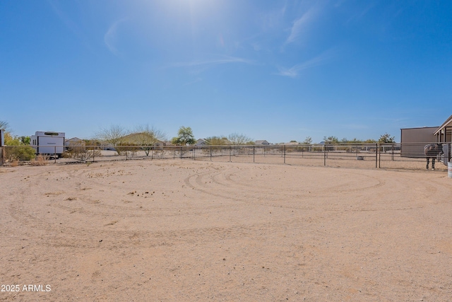 view of yard featuring an enclosed area and fence