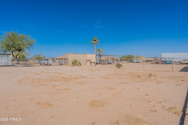 view of yard featuring an outbuilding and an exterior structure