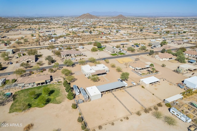 birds eye view of property with a mountain view and a desert view