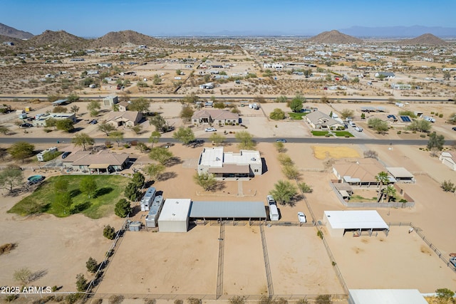 aerial view featuring a mountain view and view of desert