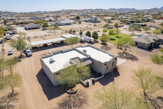 birds eye view of property with a mountain view