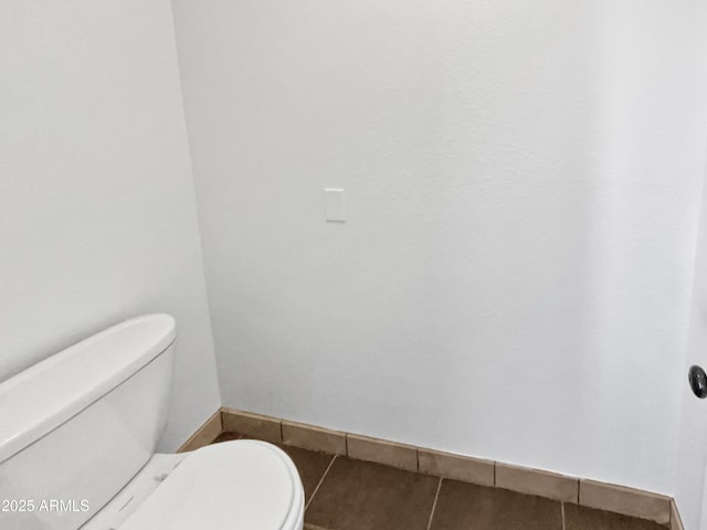 bathroom with tile patterned flooring and toilet