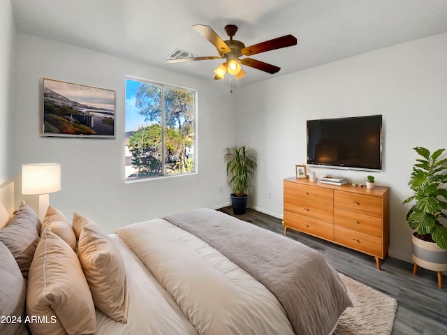 bedroom featuring dark wood-type flooring and ceiling fan