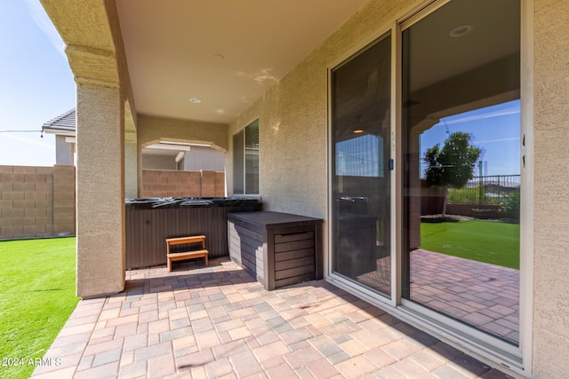 view of patio with a hot tub