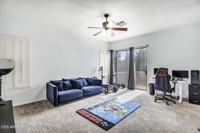 carpeted office space with ceiling fan