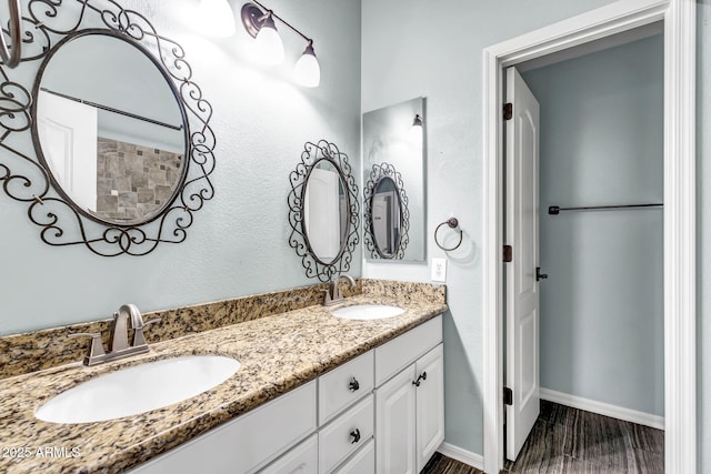 bathroom with hardwood / wood-style flooring and vanity