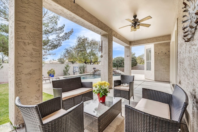 view of patio with ceiling fan, an outdoor hangout area, and a fenced in pool