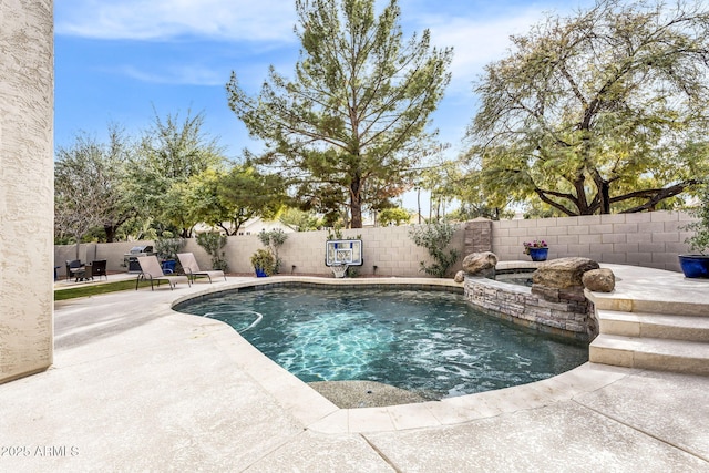 view of swimming pool featuring a patio area