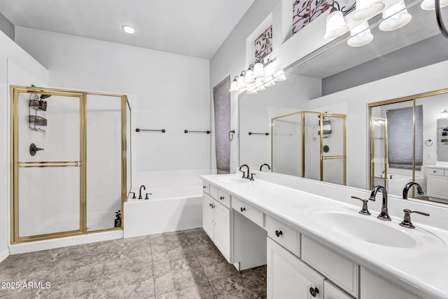 bathroom featuring shower with separate bathtub and vanity