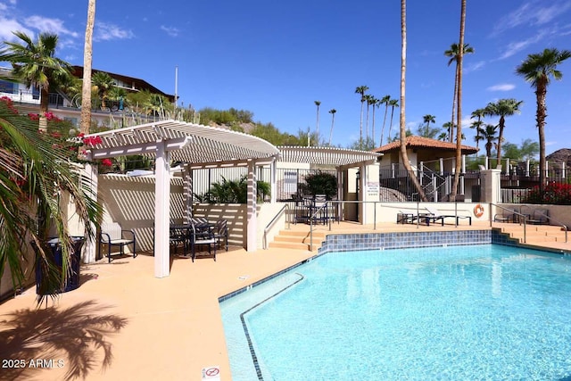 view of swimming pool with a pergola and a patio