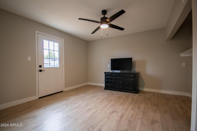 interior space with ceiling fan and light hardwood / wood-style floors