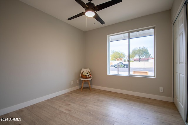 spare room with ceiling fan and light hardwood / wood-style flooring