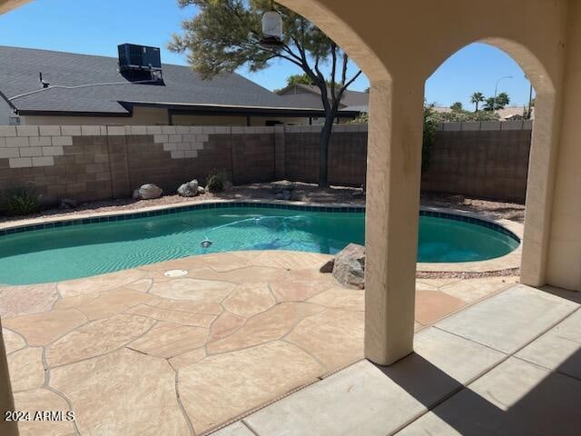 view of pool featuring cooling unit