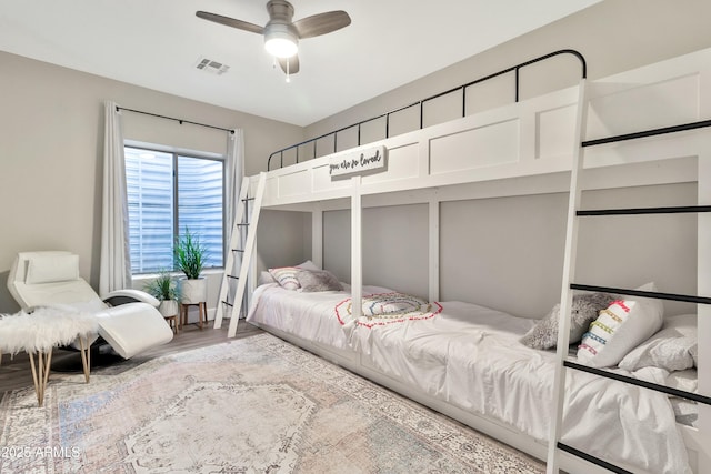 bedroom featuring a ceiling fan, light wood-type flooring, and visible vents