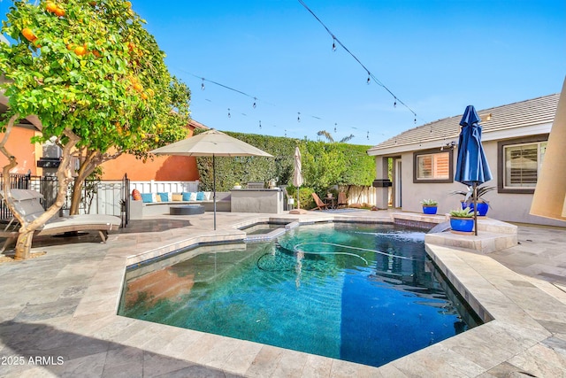 view of swimming pool featuring a fenced in pool, fence, a patio, and an in ground hot tub