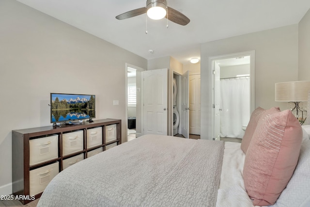 bedroom with washer / clothes dryer, connected bathroom, and ceiling fan