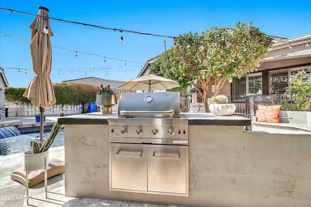 view of patio / terrace featuring area for grilling and fence