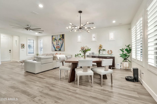 dining space with light wood-style floors, baseboards, and recessed lighting