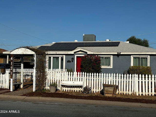 view of front of home with a gazebo and solar panels