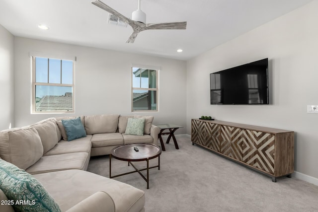 living area with ceiling fan, recessed lighting, baseboards, and light colored carpet