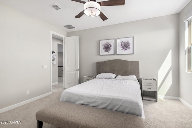 bedroom with carpet, visible vents, and baseboards