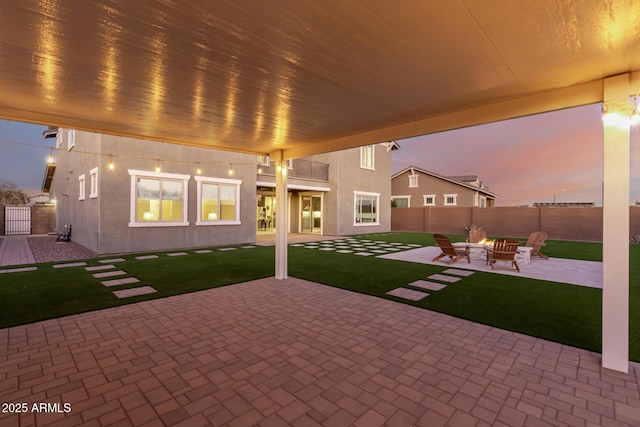 view of patio featuring a fire pit and a fenced backyard