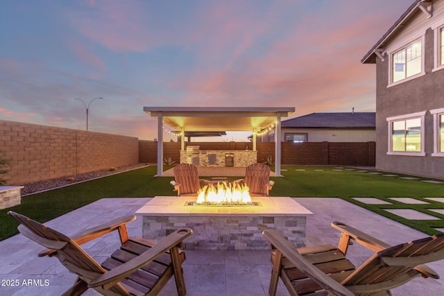 view of patio / terrace featuring a fire pit and a fenced backyard