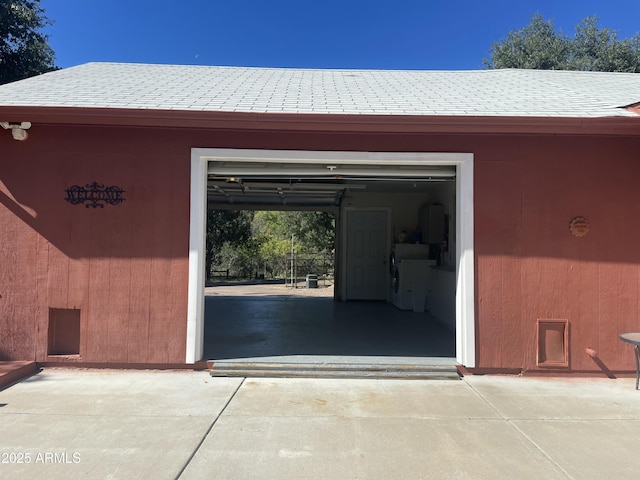 view of exterior entry with a garage