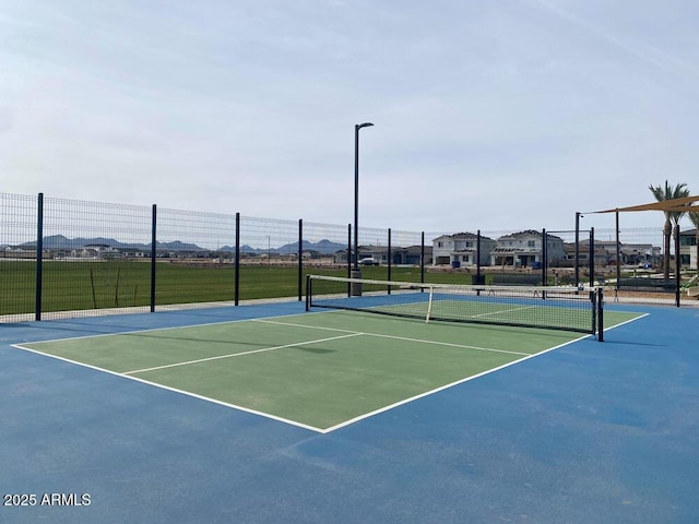 view of tennis court with basketball court