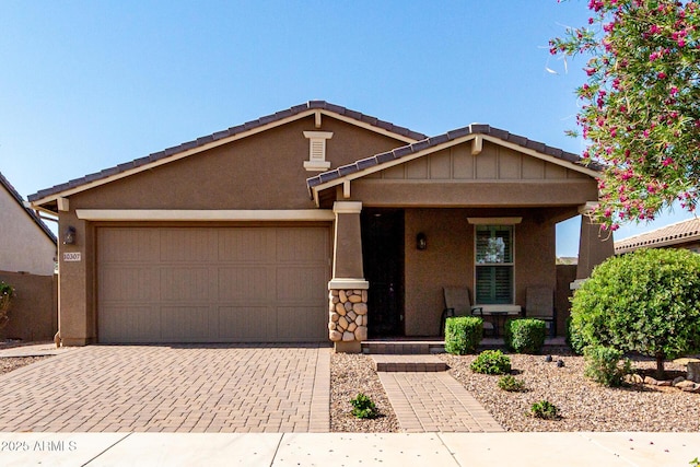 10307 E Tiburon Ave, Mesa, AZ 85212 - view of front of house with decorative driveway, a garage, covered porch, and stucco siding