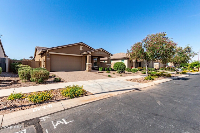 10307 E Tiburon Ave, Mesa, AZ 85212 - view of front of home featuring stucco siding, driveway, an attached garage, and fence