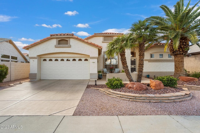 mediterranean / spanish house featuring a garage