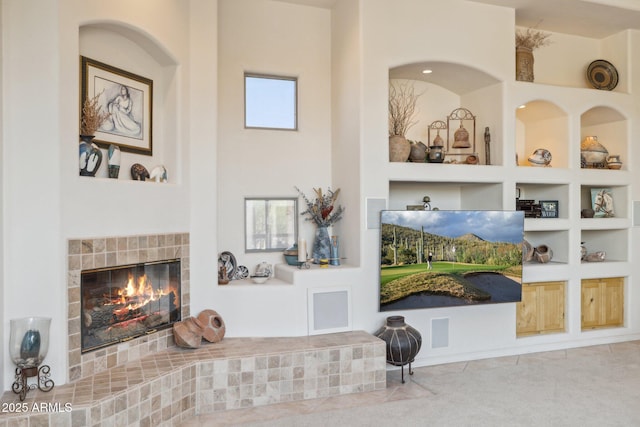 148 N La Barge Rd, Apache Junction, AZ 85119 - tiled living area with a fireplace and built in shelves