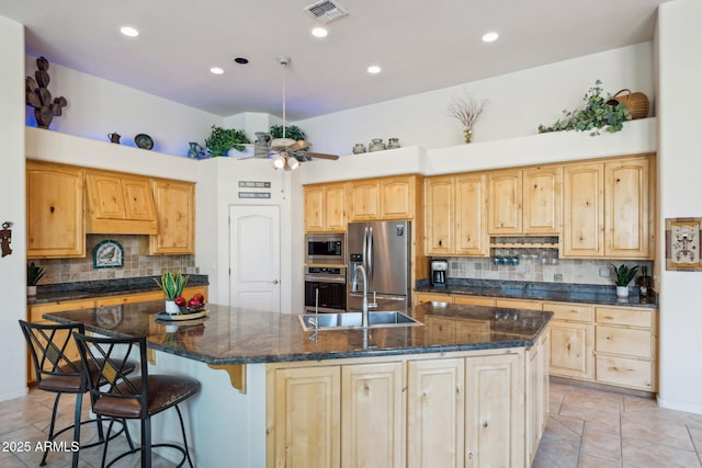 148 N La Barge Rd, Apache Junction, AZ 85119 - kitchen featuring stainless steel appliances, light brown cabinetry, decorative backsplash, light tile patterned floors, and a spacious island