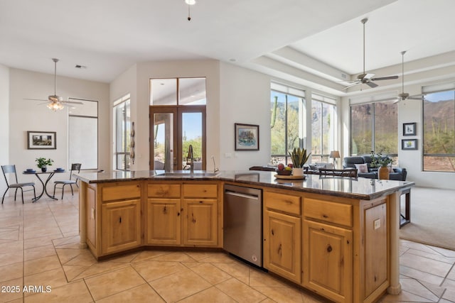 148 N La Barge Rd, Apache Junction, AZ 85119 - kitchen with dishwasher, a ceiling fan, open floor plan, and dark stone counters