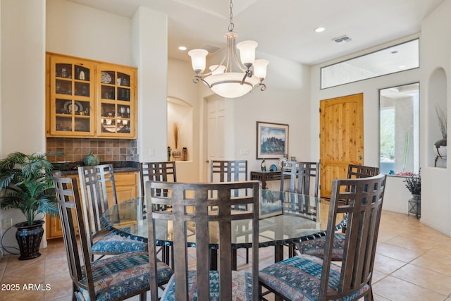 148 N La Barge Rd, Apache Junction, AZ 85119 - dining room featuring light tile patterned floors, a chandelier, arched walkways, and recessed lighting