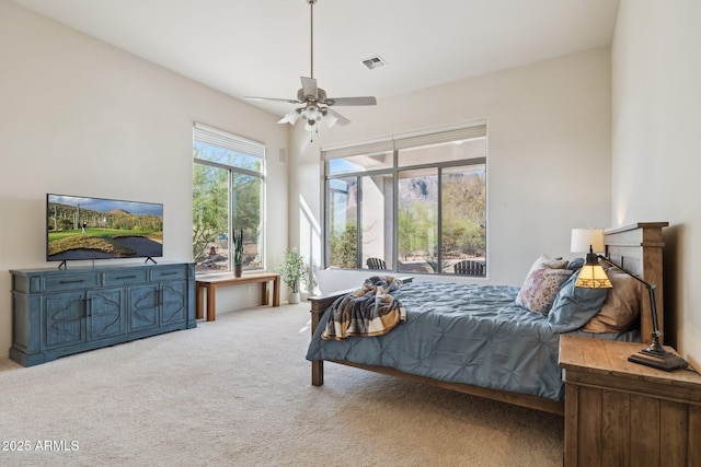 148 N La Barge Rd, Apache Junction, AZ 85119 - bedroom with carpet floors, a ceiling fan, and access to exterior