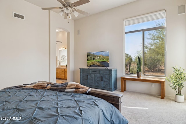 148 N La Barge Rd, Apache Junction, AZ 85119 - bedroom featuring arched walkways, carpet, and connected bathroom