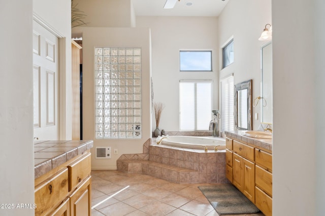 148 N La Barge Rd, Apache Junction, AZ 85119 - full bathroom with tile patterned flooring, a bath, and vanity