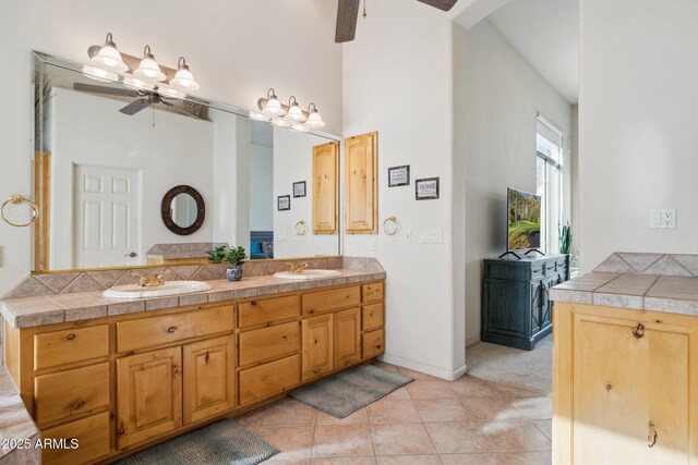 148 N La Barge Rd, Apache Junction, AZ 85119 - full bath featuring a ceiling fan, double vanity, tile patterned floors, and a high ceiling