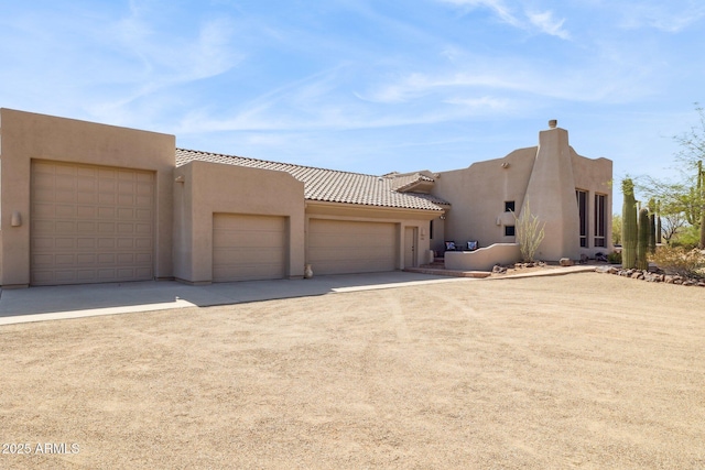 148 N La Barge Rd, Apache Junction, AZ 85119 - view of front of home featuring stucco siding, concrete driveway, and an attached garage