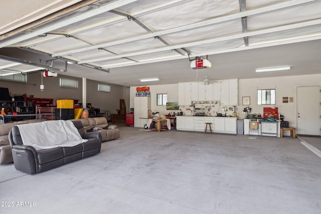 148 N La Barge Rd, Apache Junction, AZ 85119 - garage with a garage door opener and a workshop area