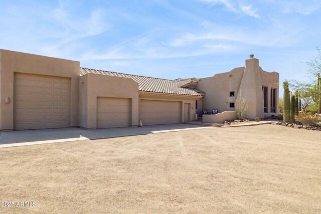148 N La Barge Rd, Apache Junction, AZ 85119 - view of front of home featuring stucco siding, concrete driveway, and an attached garage