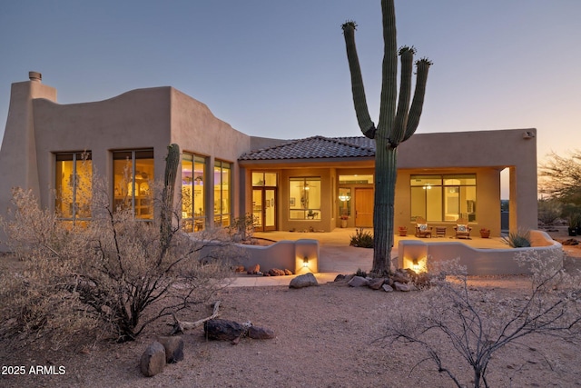 148 N La Barge Rd, Apache Junction, AZ 85119 - back of property with a fire pit, a patio, and stucco siding