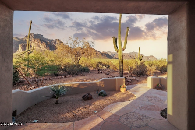 148 N La Barge Rd, Apache Junction, AZ 85119 - patio terrace at dusk with a mountain view and a patio