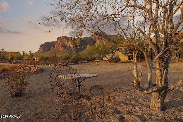 148 N La Barge Rd, Apache Junction, AZ 85119 - yard at dusk featuring a mountain view