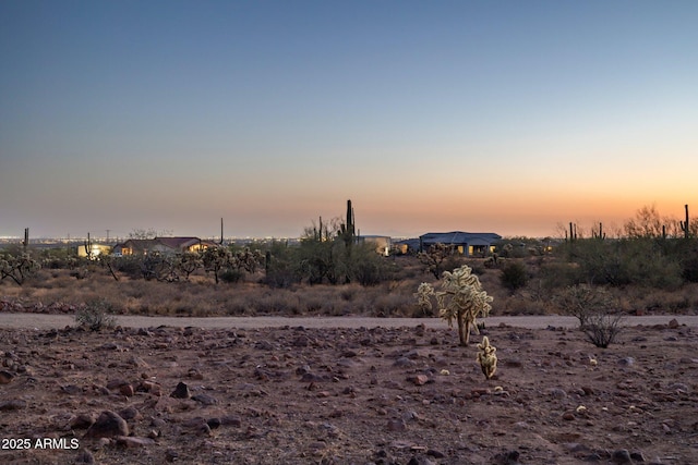 148 N La Barge Rd, Apache Junction, AZ 85119 - yard at dusk with a view of countryside