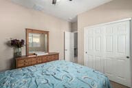 bedroom featuring a closet and ceiling fan