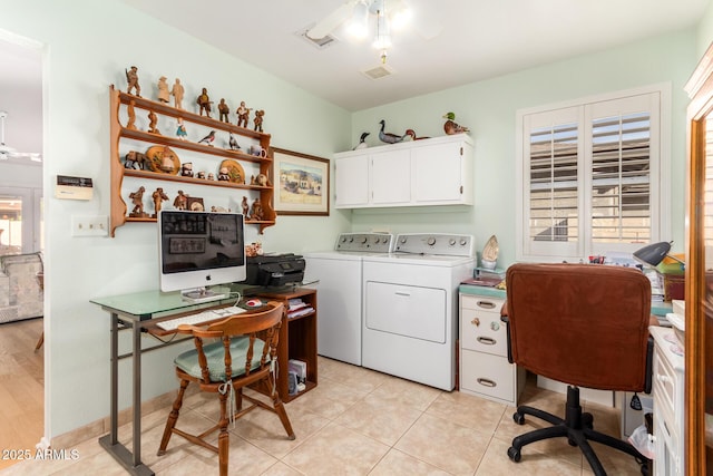 office space featuring independent washer and dryer, light tile patterned floors, and ceiling fan